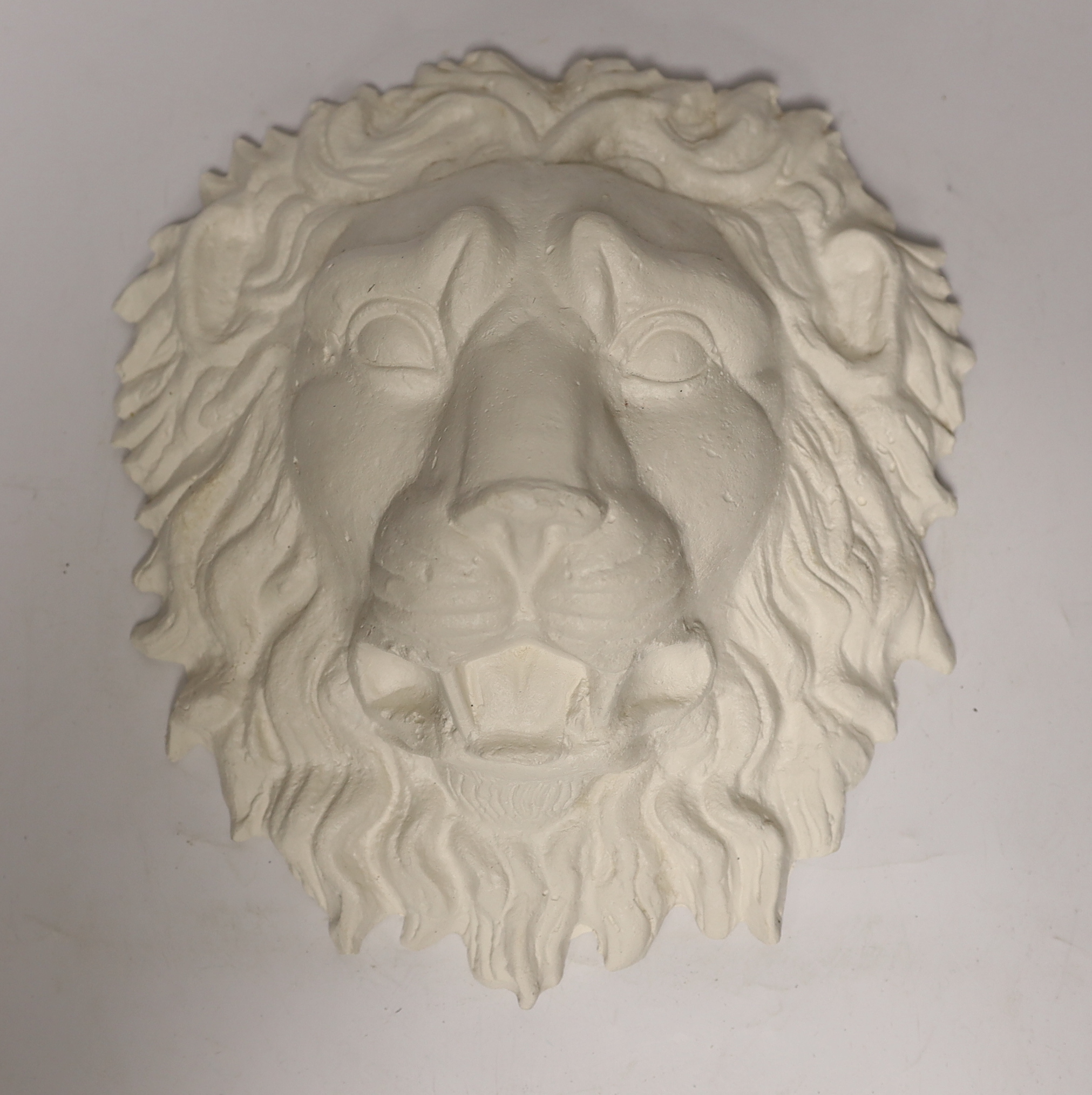 A plaster griffin Roman lion and a pair of lion paws